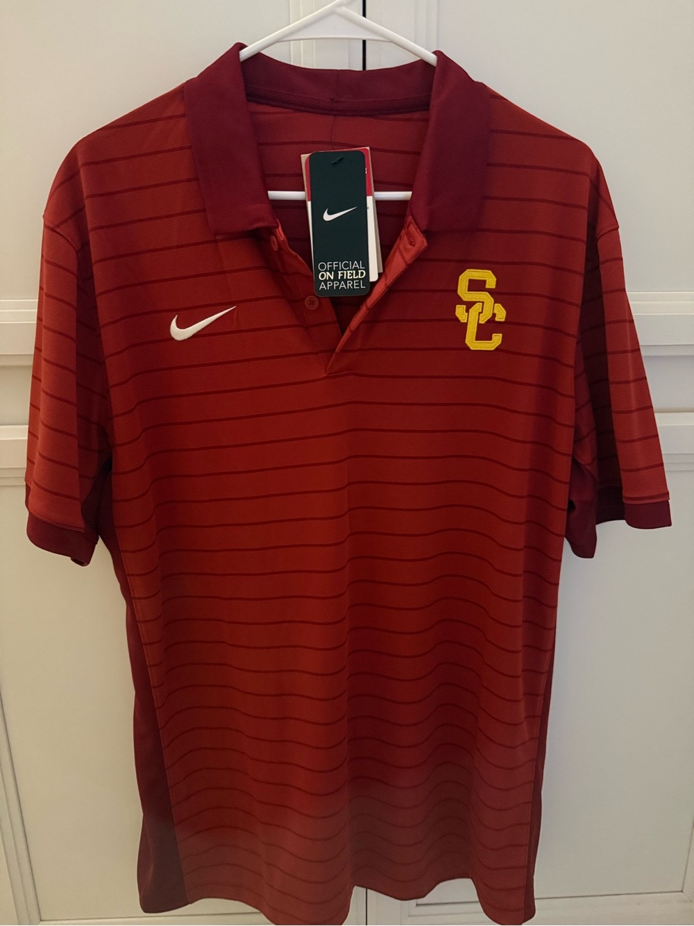 Brand new Nike Men’s USC Cardinal Polo with Yellow Logo